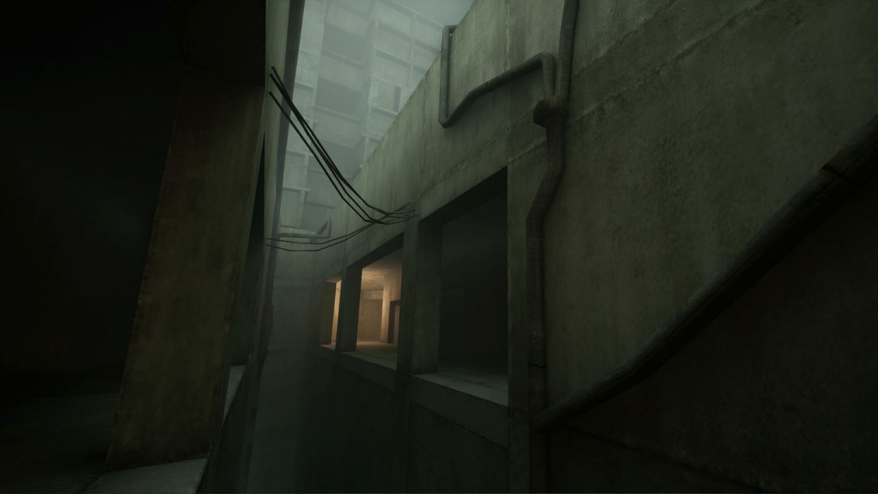 Narrow concrete alley with hanging cables and warm-lit window openings in VHOLUME